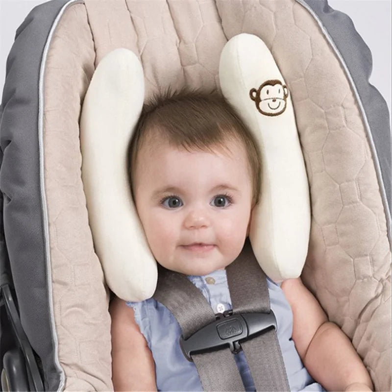 Infant stroller neck pillow and car seat head protector in a banana shape, baby stroller sleeping neck support pillow